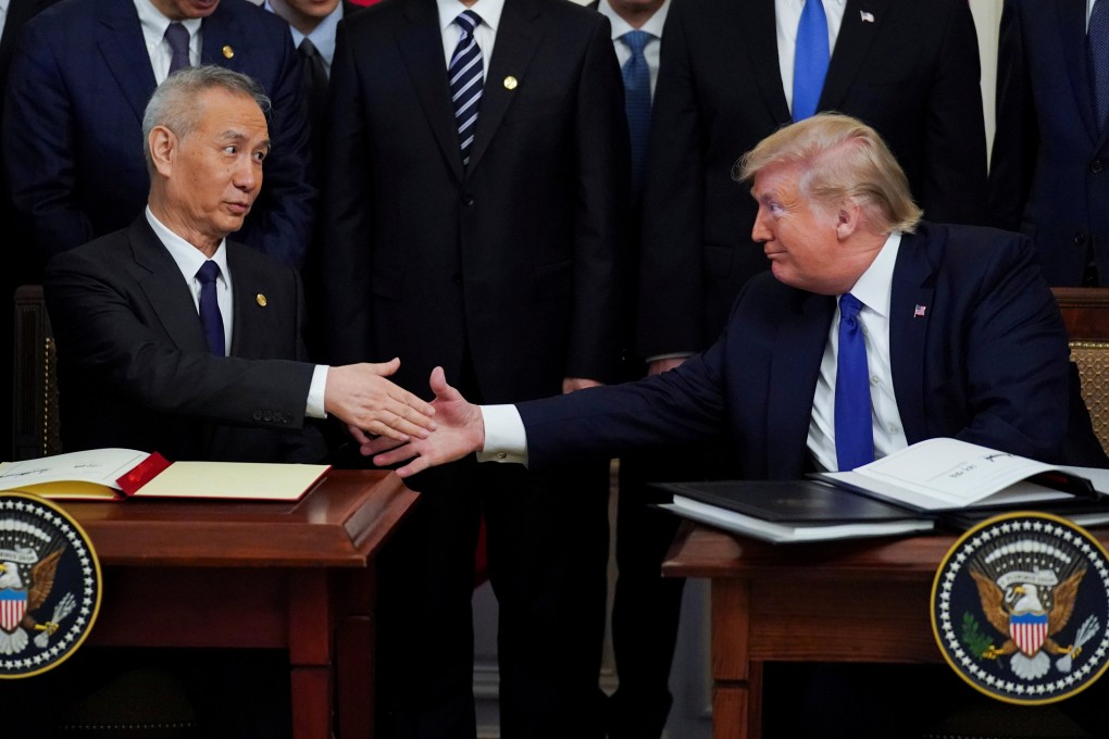 Vice-Premier Liu He (left) and then US president Donald Trump shake hands after signing phase one of the US-China trade agreement during a ceremony in the East Room of the White House in Washington on January 15, 2020. Photo: Reuters