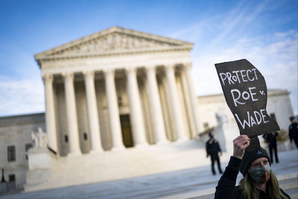 A demonstrator holds a “Protect Roe v. Wade” sign outside the US Supreme Court on Wednesday. Photo: Bloomberg