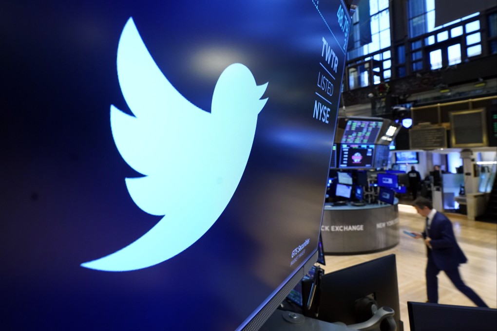The logo for Twitter appears above a trading post on the floor of the New York Stock Exchange. Photo: AP