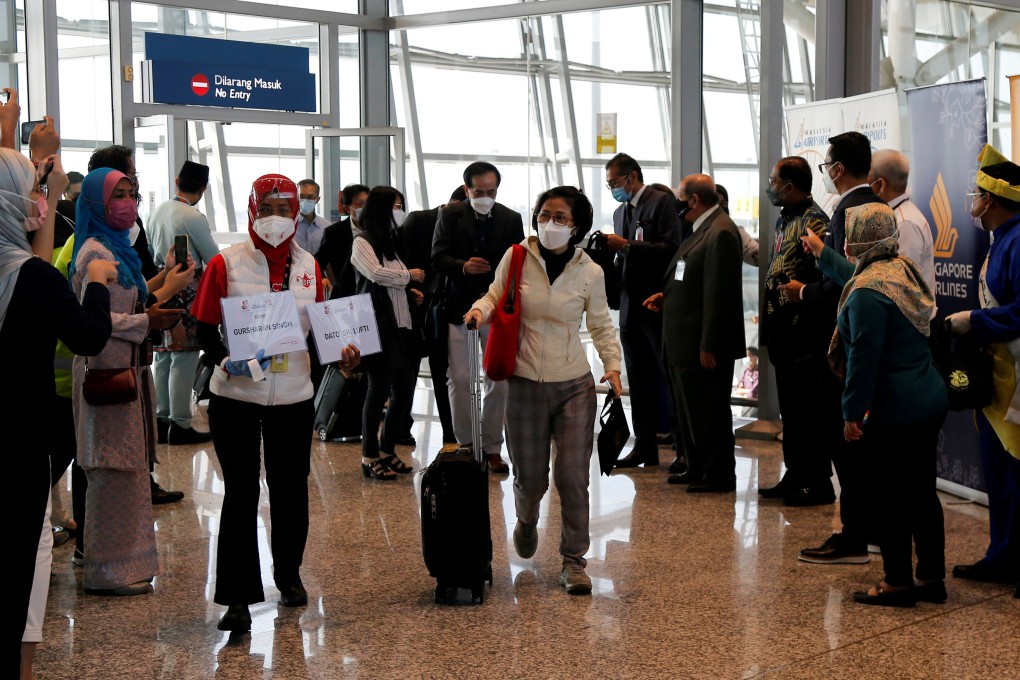 Travellers arrive at the airport in Kuala Lumpur, Malaysia. Photo: Reuters