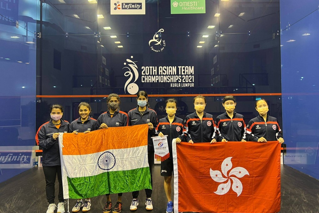 The Hong Kong women’s team and India pose for a photo before the match. Photo: Hong Kong Squash