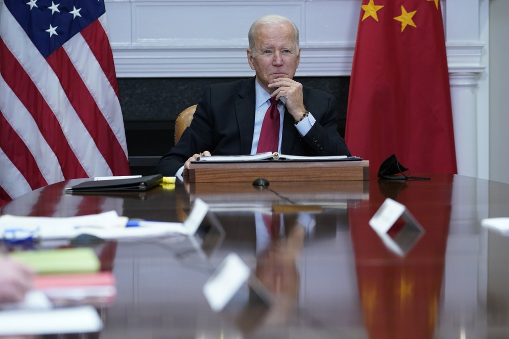 US President Joe Biden listens as he meets virtually with Chinese President Xi Jinping. Photo: AP