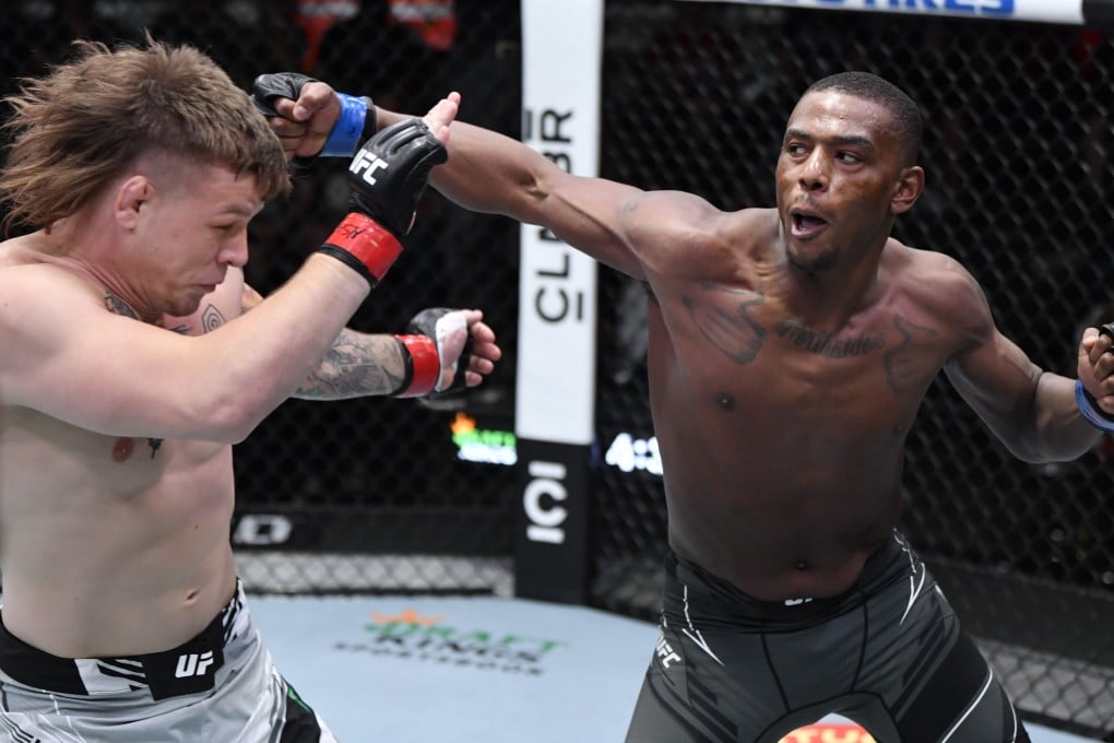 Jamahal Hill (right) punches Jimmy Crute in a light heavyweight fight at UFC Vegas 44. Photos: Jeff Bottari/Zuffa LLC