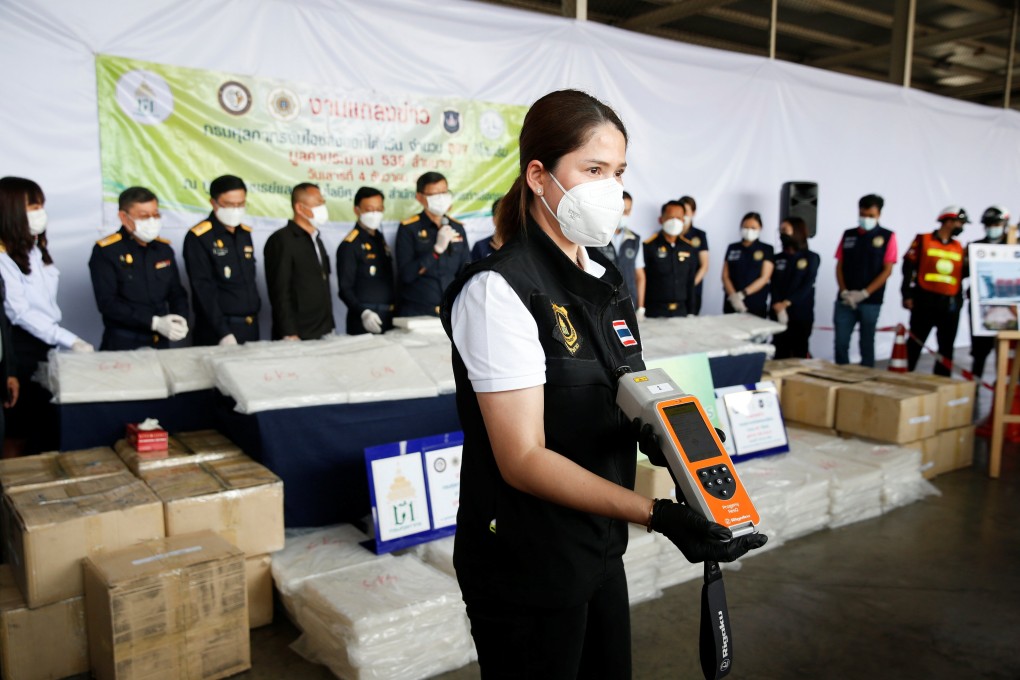 Thai authorities show the result of a machine test as they seized crystal meth in Bangkok, Thailand on Saturday. Photo: Reuters
