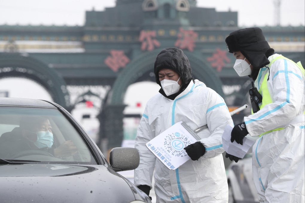 Officials check a motorist’s details in Harbin, where seven new cases were reported. Photo: Xinhua
