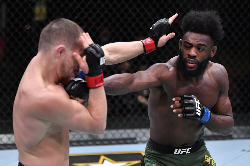 Aljamain Sterling (right) punches Petr Yan in a UFC bantamweight championship fight at UFC 259 in Las Vegas, Nevada. Photos: Jeff Bottari/Zuffa LLC