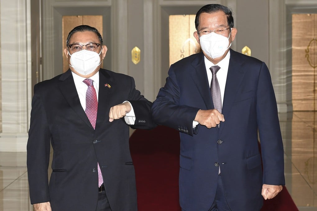 Cambodian Prime Minister Hun Sen, right, greets Myanmar Foreign Minister Wunna Maung Lwin in Phnom Penh on Tuesday. Photo: An Khoun SamAun/National Television of Cambodia via AP