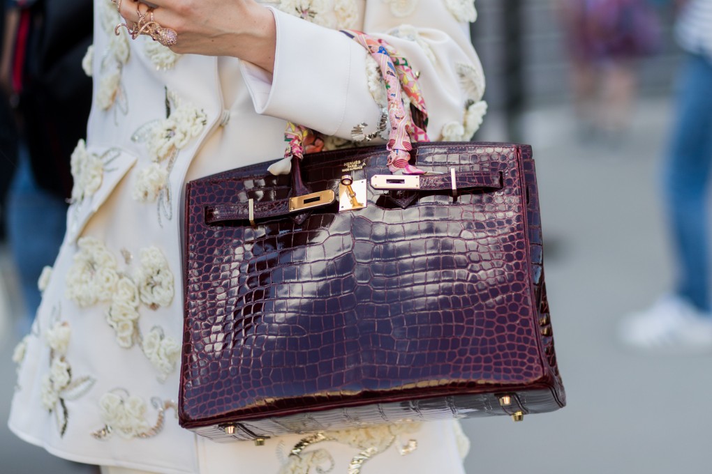 A guest with an Hermès Birkin bag outside Ralph & Russo during Paris Fashion Week in July, 2017. The coveted bag is hard to find and to buy. Photo: Getty Images