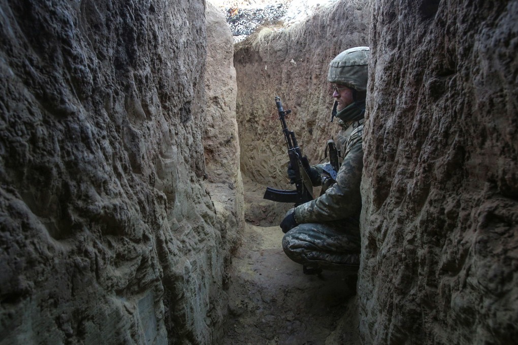 A Ukrainian serviceman rests in a trench not far from the city of Horlivka, which is controlled by pro-Russian militants. The new US defence bill includes US$300 million for Ukraine’s military. Photo: EPA-EFE