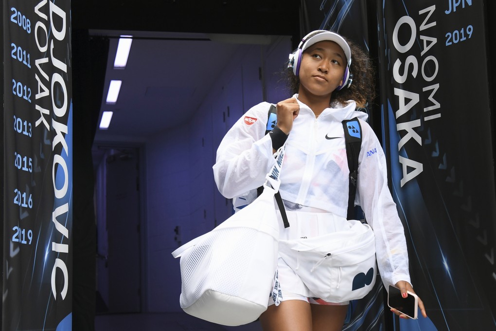 Japan’s Naomi Osaka walks into Margaret Court Arena for her second round singles match against China’s Zheng Saisai at the Australian Open 2020 tennis tournament in Melbourne. Photo: Andy Brownbill