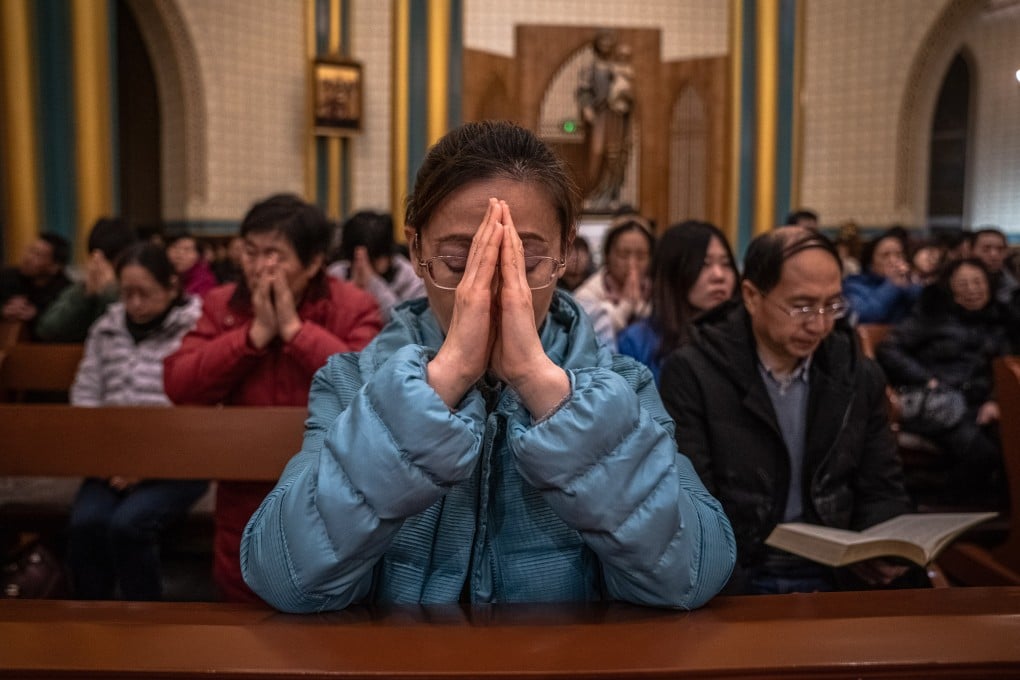 Chinese Catholics attend a Christmas Eve mass at a church in Beijing. Christianity took root in China in the 16th century thanks to Jesuit missionaries who made converts of prominent people, but first reached China nearly 1,000 years earlier. Photo: EPA-EFE