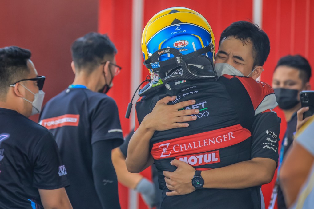 Hong Kong driver Darryl O’Young celebrates with Craft Bamboo Racing team mechanics after the Macau Grand Prix GT Cup final round event in Macau. Photo: Craft Bamboo Racing