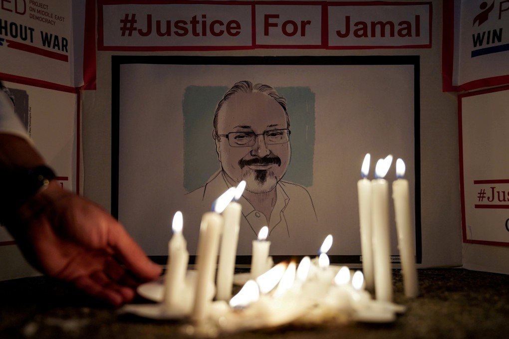 The Committee to Protect Journalists and other press freedom activists hold a candlelight vigil in front of the Saudi embassy in October 2019 to mark the anniversary of the killing of Jamal Khashoggi. Photo: Reuters