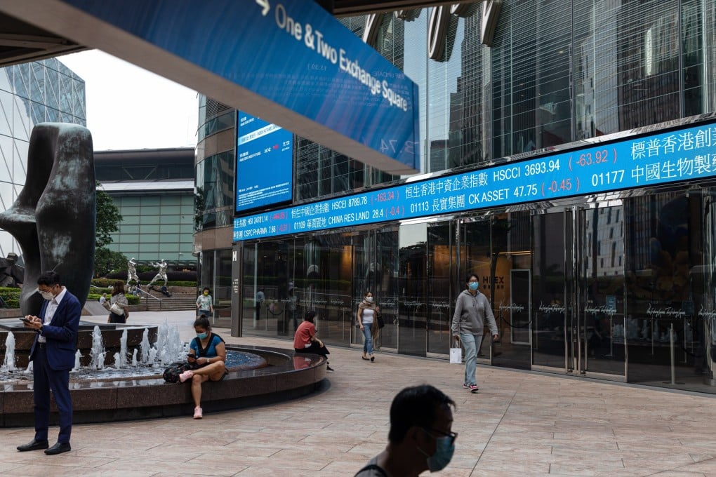 People walk past the Exchange Square in Central, Hong Kong. Photo: EPA-EFE