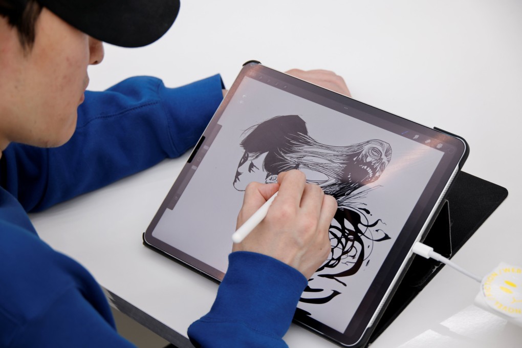 Hongjacga, the cartoonist of webtoon Dr. Brain, which was recently adapted by Apple TV+, draws in his studio. Photo: Reuters