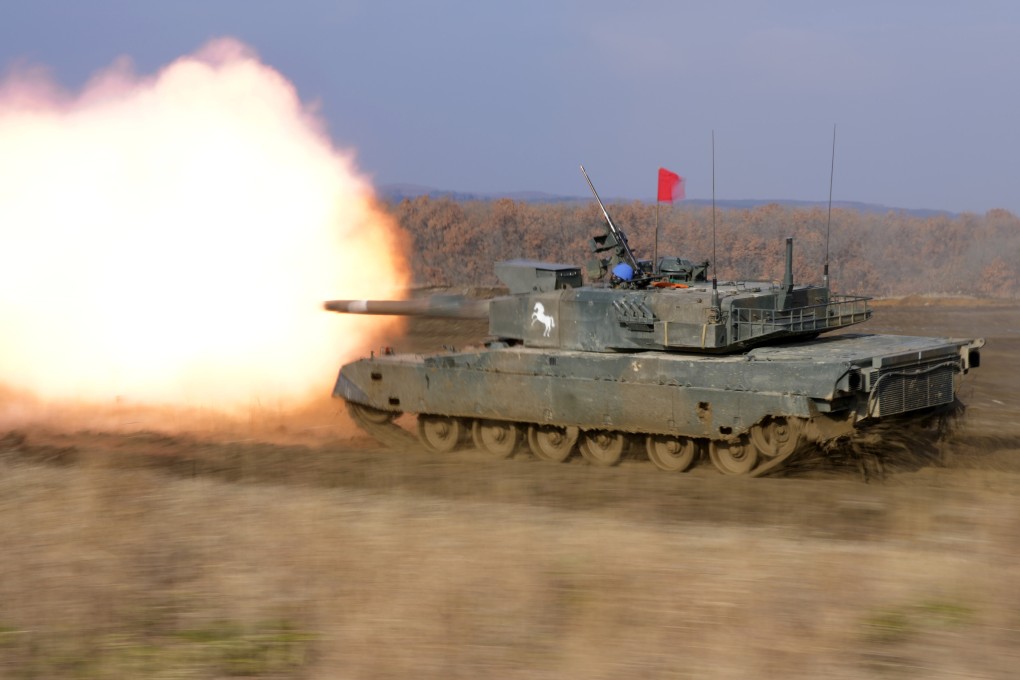 A Japanese tank fires during an exercise in Hokkaido on December 7, 2021. Photo: AP