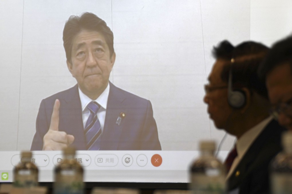 Former Japanese Prime Minister Shinzo Abe, seen on a screen during a meeting in Taipei, has sparked Chinese anger with his comments on Taiwan. Photo: AP