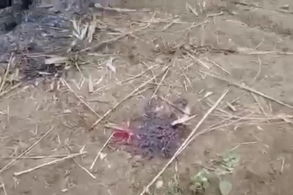 A scene from a video shows a bloodstain on the ground near charred corpses in Done Taw village in the Sagaing region of Myanmar, after an alleged massacre by government troops. Photo: AP