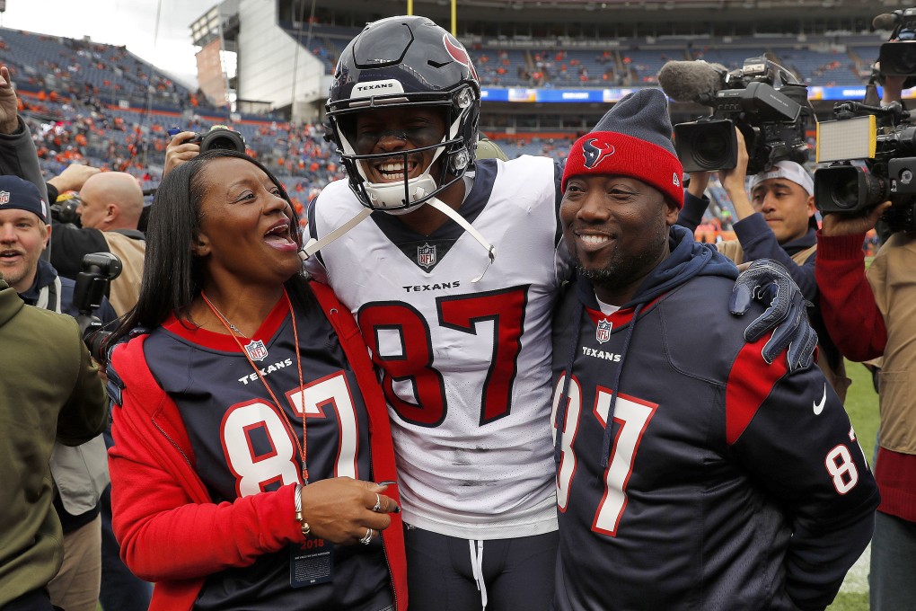 Demaryius Thomas with his parents, Bobby Thomas, right, and Katina Smith. Thomas, who eared five straight Pro Bowls and a Super Bowl ring has died at the age of 33. Photo: David Zalubowski