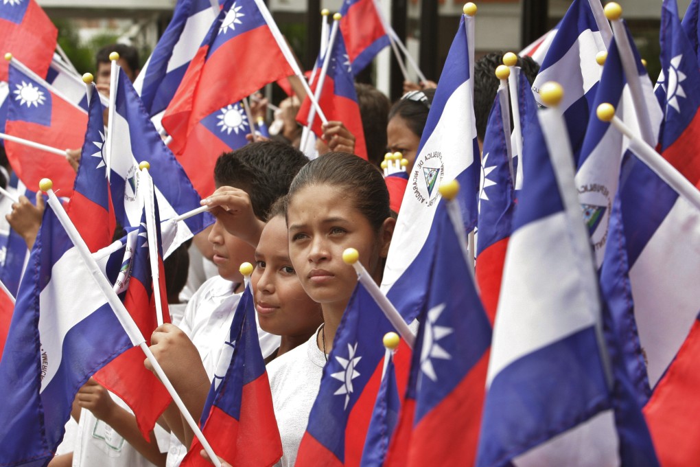 In 2007, Taiwan and Nicaragua relations were solid as students in Managua hold flags representing both nations at a farewell ceremony for then Taiwanese president Chen Shui-bian. Photo: AP Photo