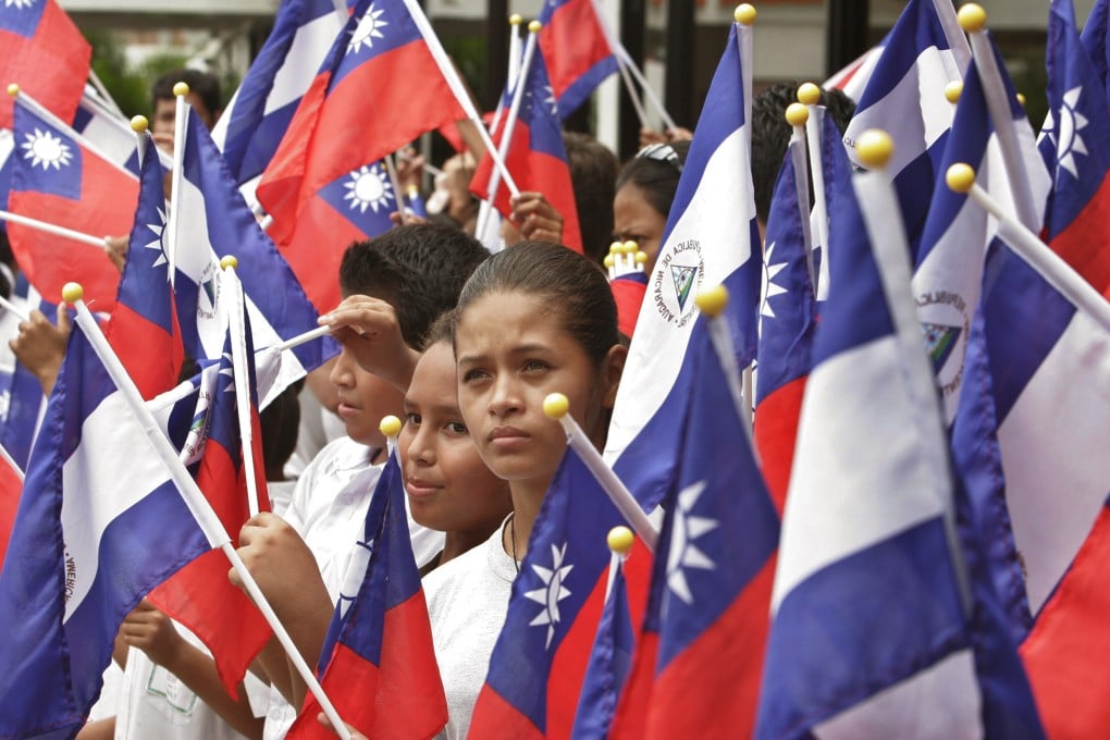 In 2007, Taiwan and Nicaragua relations were solid as students in Managua hold flags representing both nations at a farewell ceremony for then Taiwanese president Chen Shui-bian. Photo: AP Photo