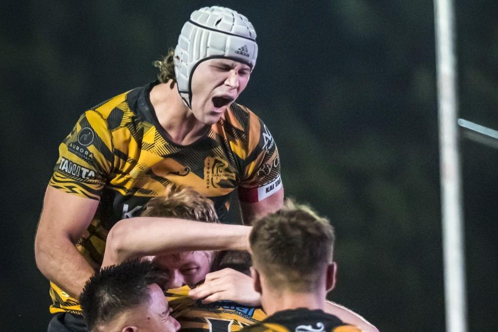 USRC Tigers captain Lawrence Miller (silver headgear) celebrates his side’s win over Kowloon. Photo: Handout