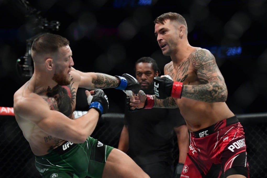 Dustin Poirier swarms Conor McGregor at UFC 264. Photo: Gary A. Vasquez/USA TODAY Sports.