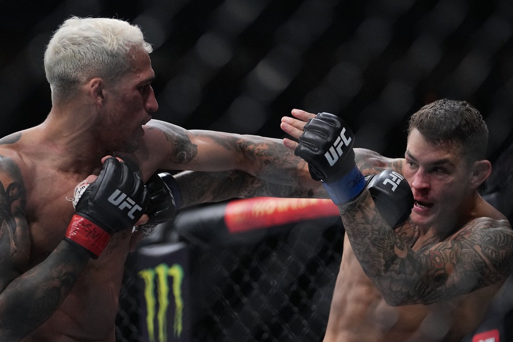 Charles Oliveira moves in with a hit against Dustin Poirier at UFC 269. Photo: Stephen R Sylvanie/USA TODAY Sports