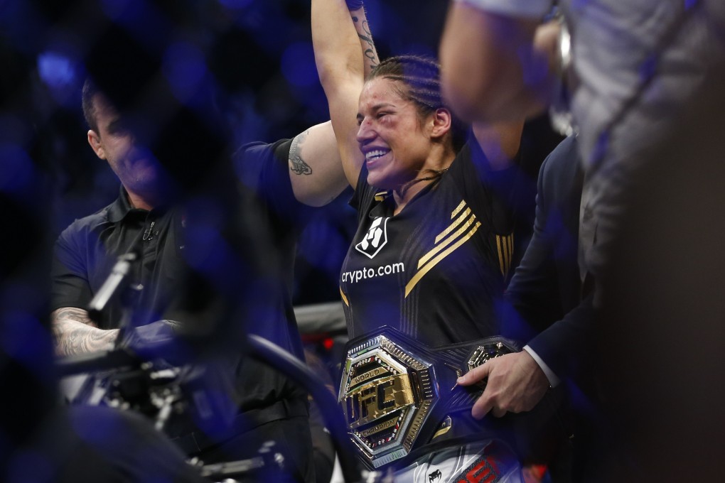 Julianna Pena smiles after defeating Amanda Nunes by submission to become the UFC bantamweight champion. Photo: AP/Chase Stevens