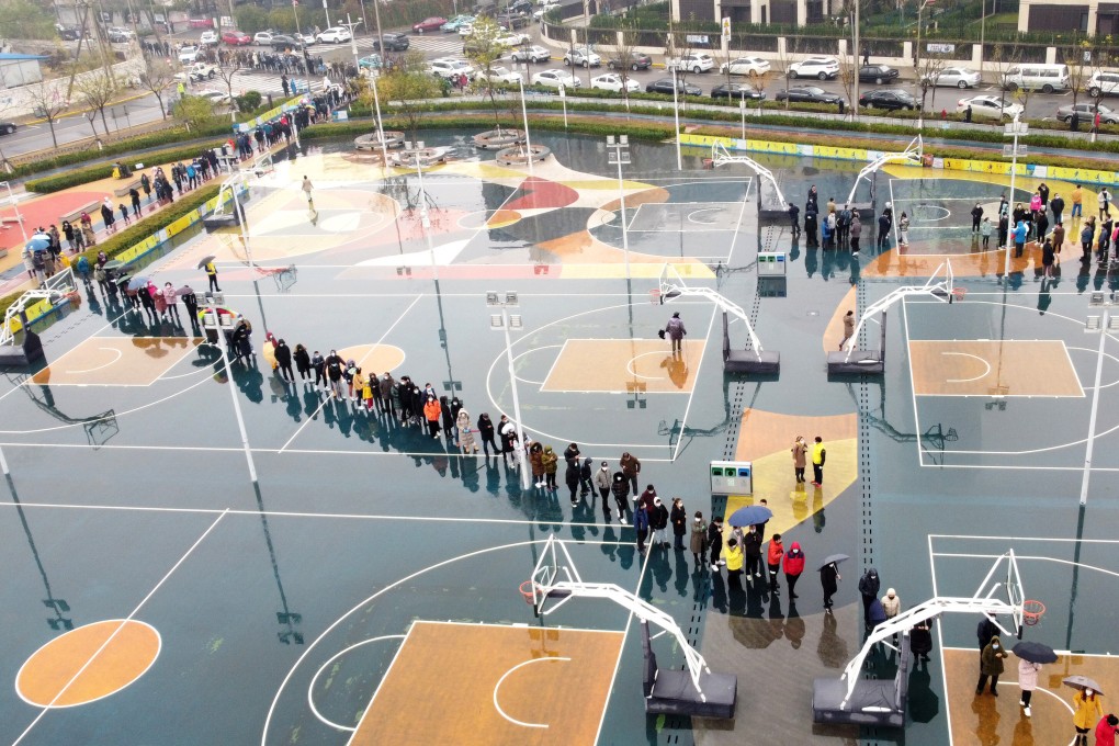 Residents line up for Covid-19 tests in Tianjin in November. Photo: Xinhua