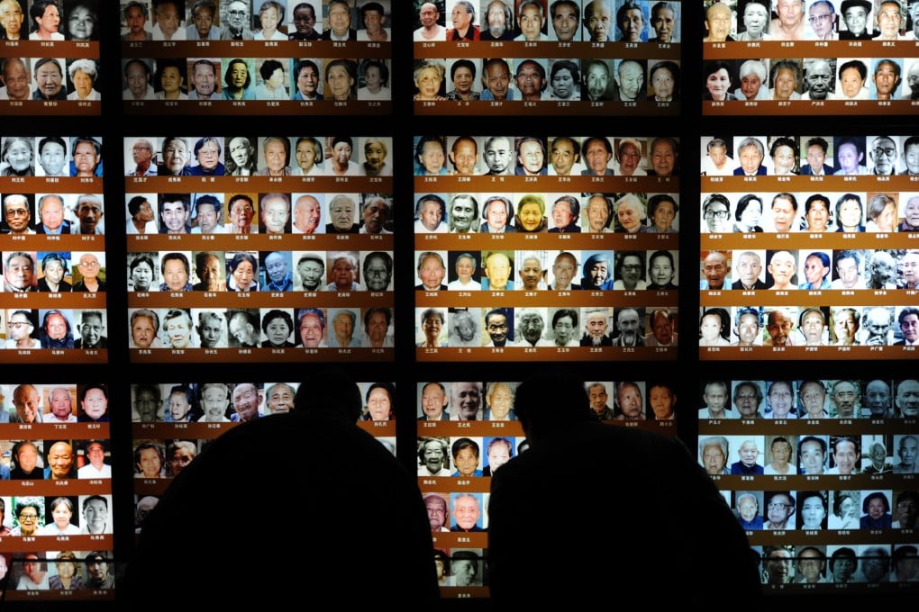 Visitors take a closer look in the Memorial Hall of the Victims in Nanjing Massacre in Nanjing. Photo: Xinhua