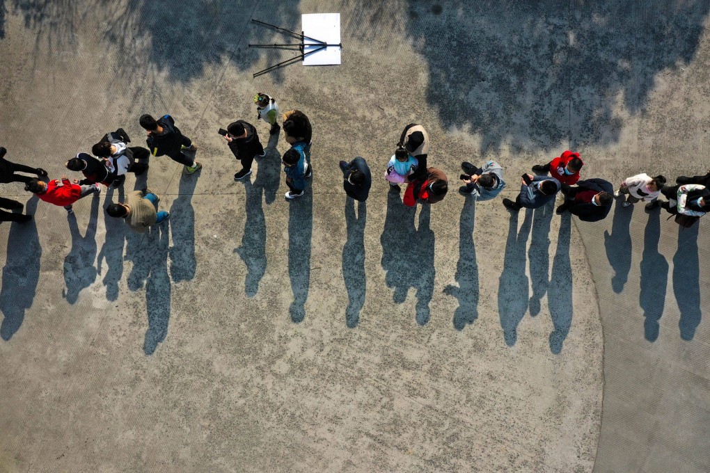 People wait to be tested for the coronavirus in Ningbo, Zhejiang province, on Tuesday. Photo: AFP