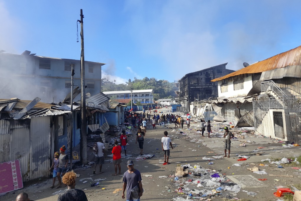 Smoke rises from burning buildings during a protest in Honiara, Solomon Islands. File photo: AP