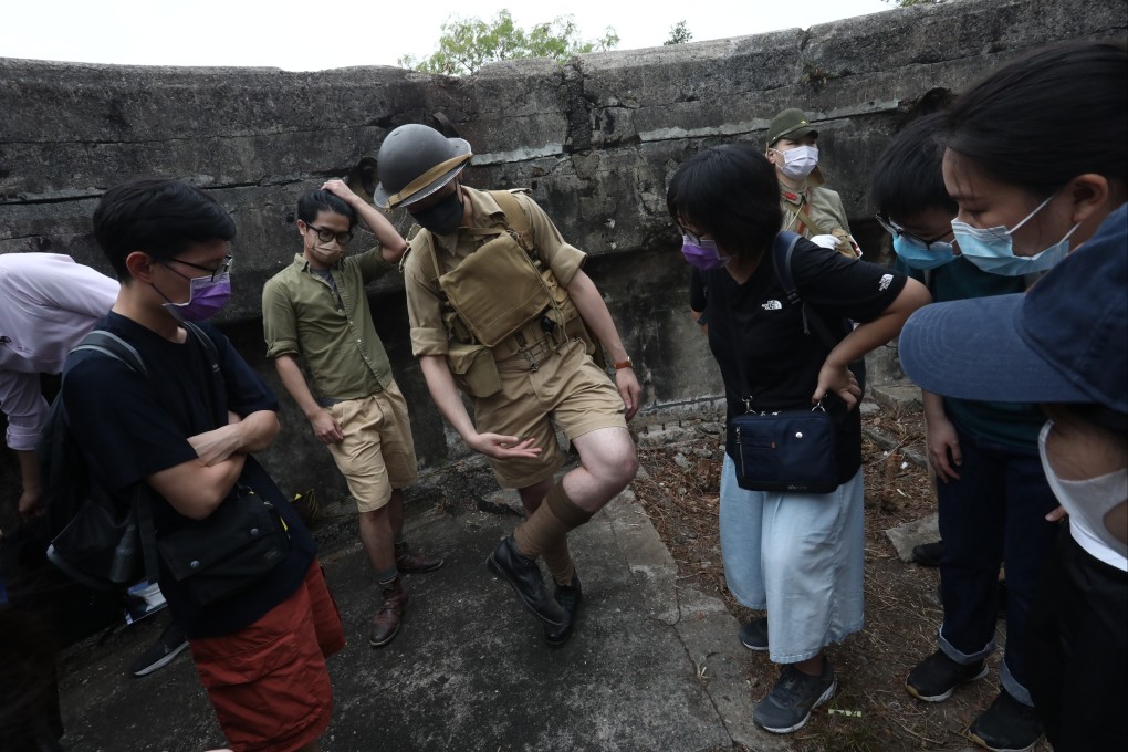 Hong Kong war history buff Franco Yeung  wears a replica uniform of Hong Kong volunteer soldiers as he leads a tour of the Mount Davis Battery. Photo: Jonathan Wong