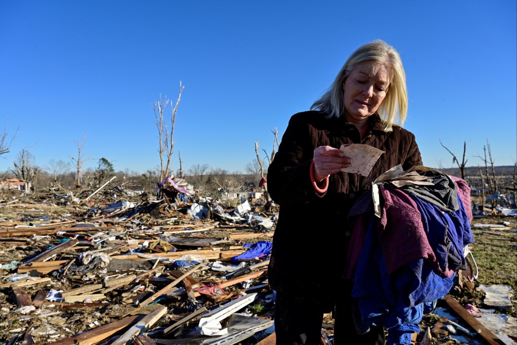 Laura Croft searches through debris in Dawson Springs, Kentucky, on Monday, near where her mother and aunt were found dead after tornadoes ripped through several US states. Photo: Reuters