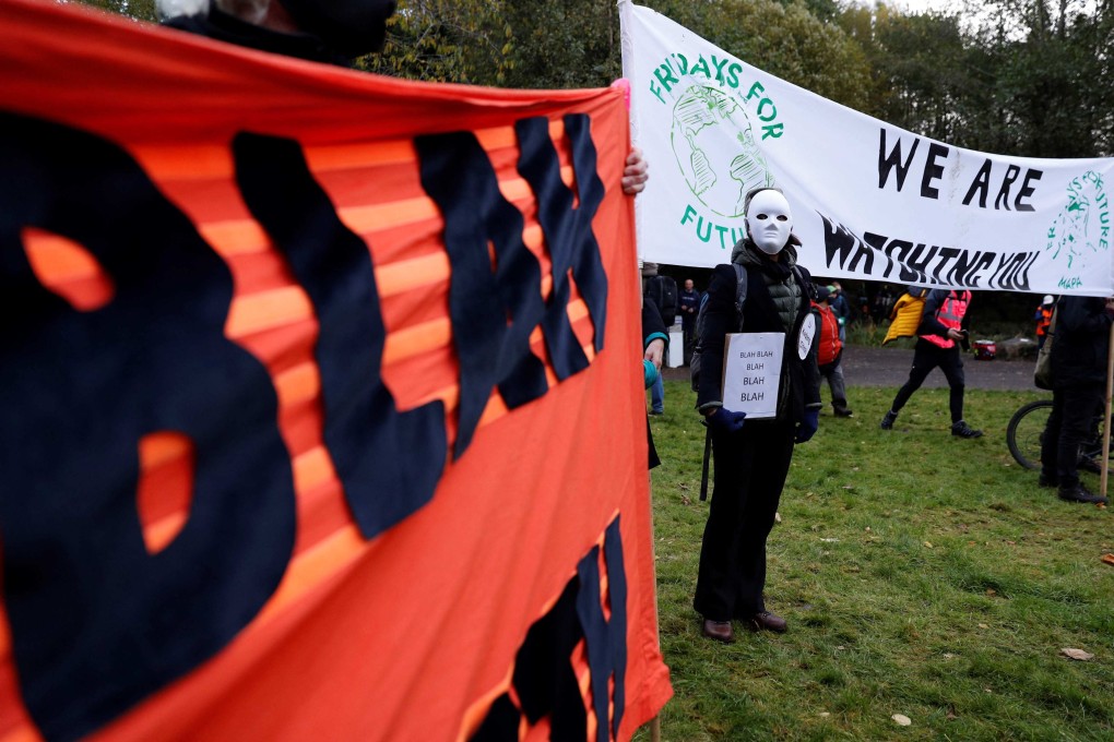 Climate activists hold placards as world leaders meet at the COP26 UN Climate Summit in Glasgow on November 1. Photo: AFP