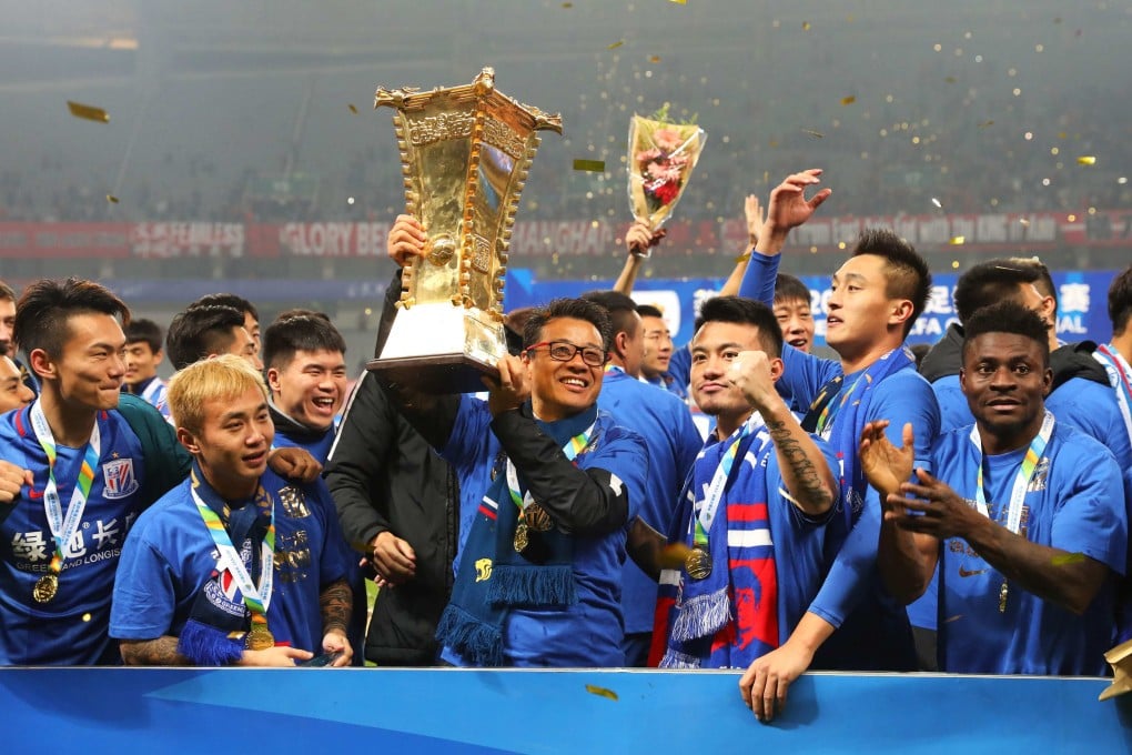 In better times: Wu Jingui holds the trophy after winning the Chinese FA Cup with Shanghai Shenhua in 2017. Photo: AFP