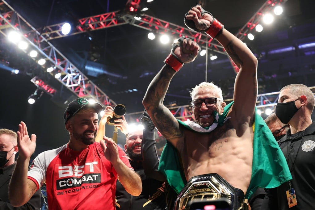 Charles Oliveira of Brazil celebrates after defeating Dustin Poirier to defend his lightweight title at the UFC 269 event at T-Mobile Arena on December 11, 2021 in Las Vegas, Nevada. Photo: Carmen Mandato/Getty Images/AFP