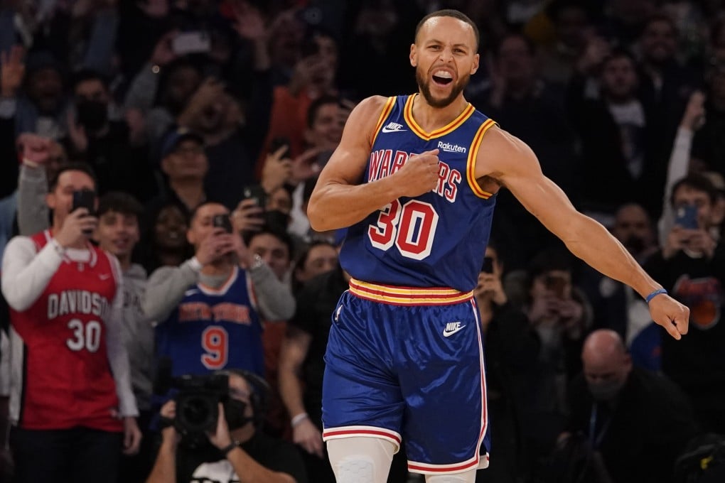 Golden State Warriors guard Stephen Curry reacts after scoring a 3-point basket during the first half of an NBA game against the New York Knicks. Photo: AP