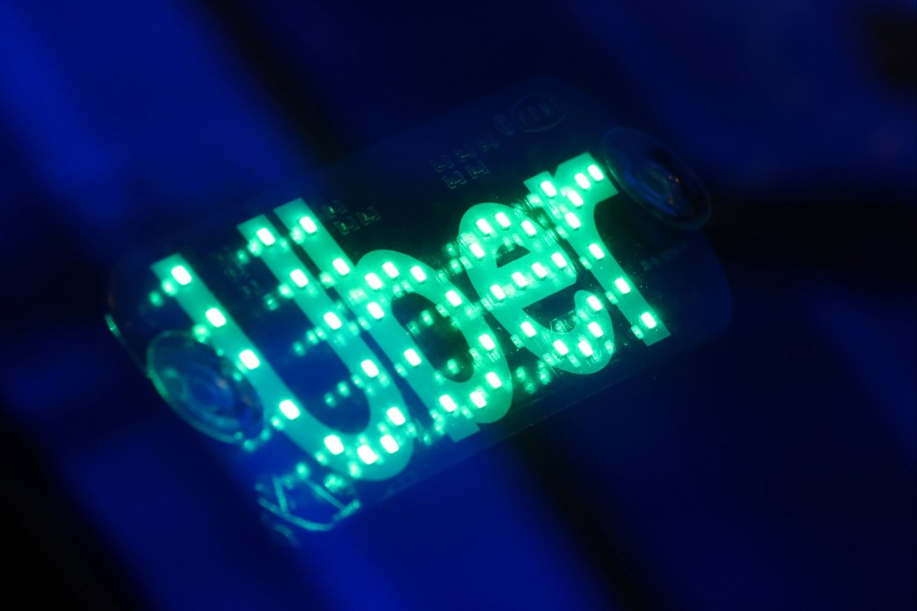 The logo for Uber Technologies is seen on a vehicle in Manhattan, New York City, November 17, 2021. Photo: Reuters