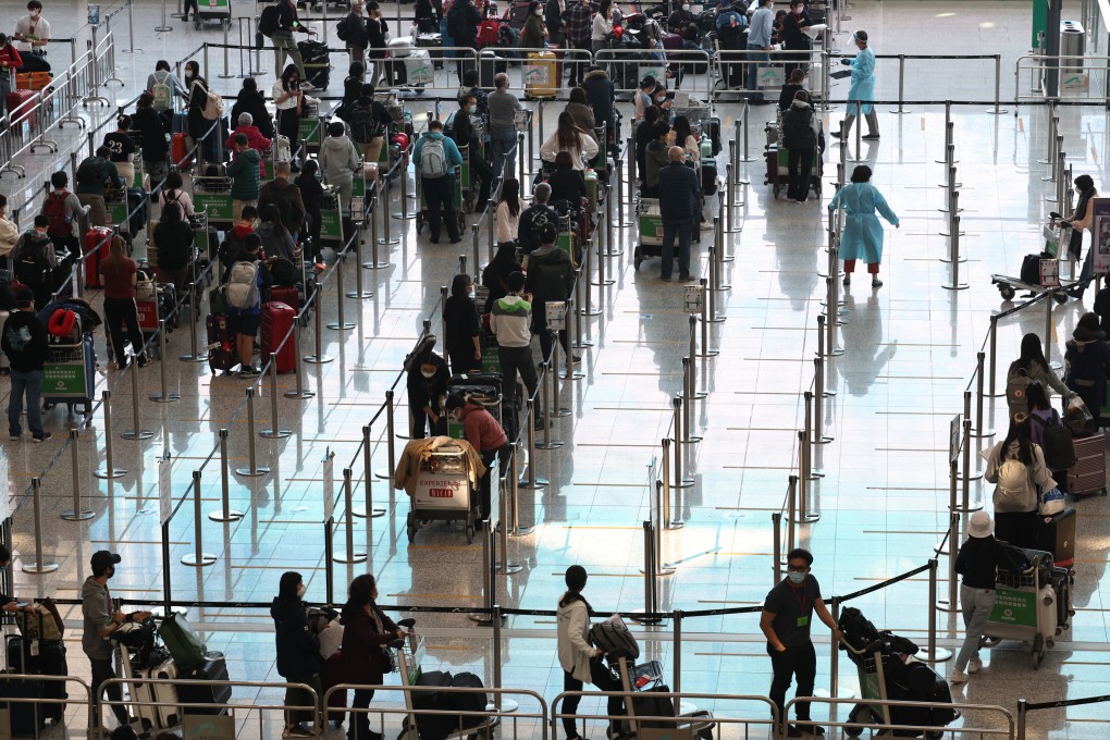 Arrivals at Hong Kong’s airport. The city is on high alert over Omicron fears, and has tightened measures against several high-risk places. Photo: K. Y. Cheng