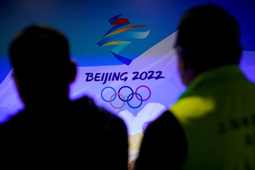 Staff members work near the emblem for Beijing 2022 Winter Olympics displayed at the Shanghai Sports Museum in Shanghai. Photo: Reuters