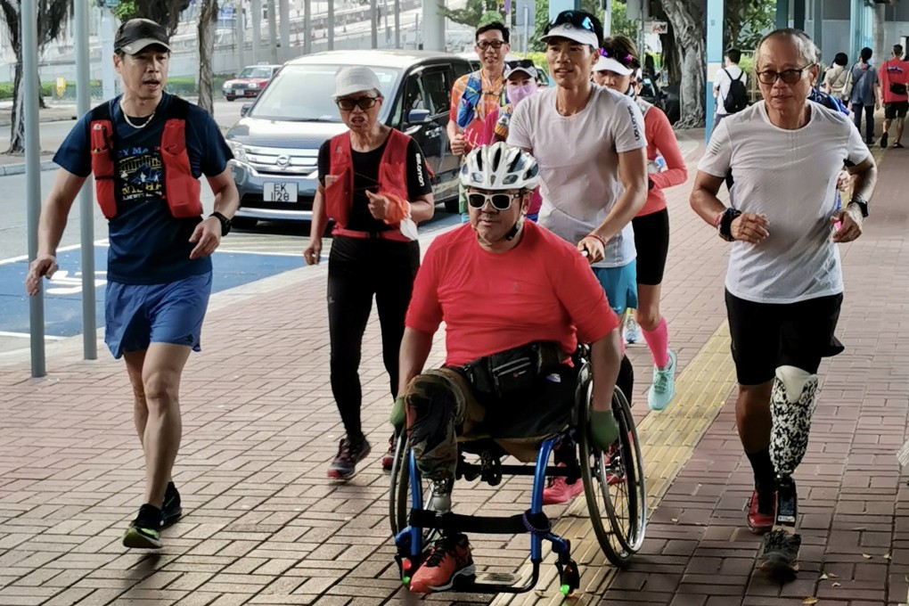 Wong Ho-fai pushes double amputee Chau Kin-ming around Hong Kong as preparation for his Trans-America run. Photo: Handout