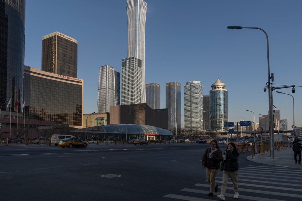 Pedestrians cross a road in Beijing on  December 13. The central government has said its key economic goals for the coming year include counteracting growth pressures and stabilising the economy. Photo: Bloomberg