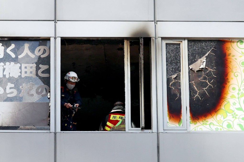 Firefighters work at the scene of a blaze in Osaka on December 17, 2021. Photo: AFP