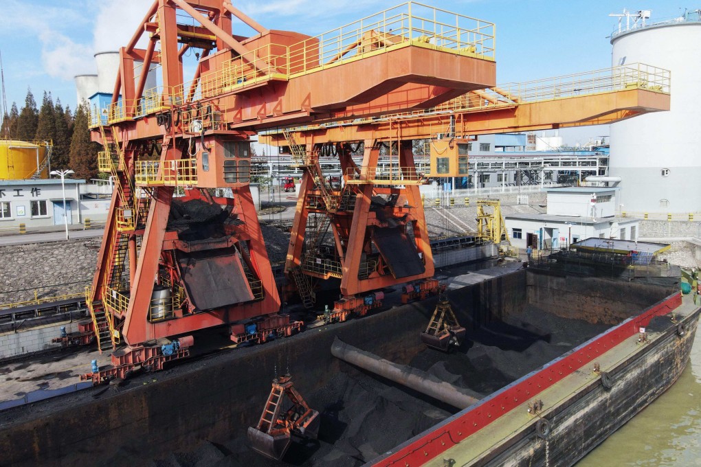 A barge unloads coal at a power station in Yangzhou, in China’s eastern Jiangsu province. Photo: AFP