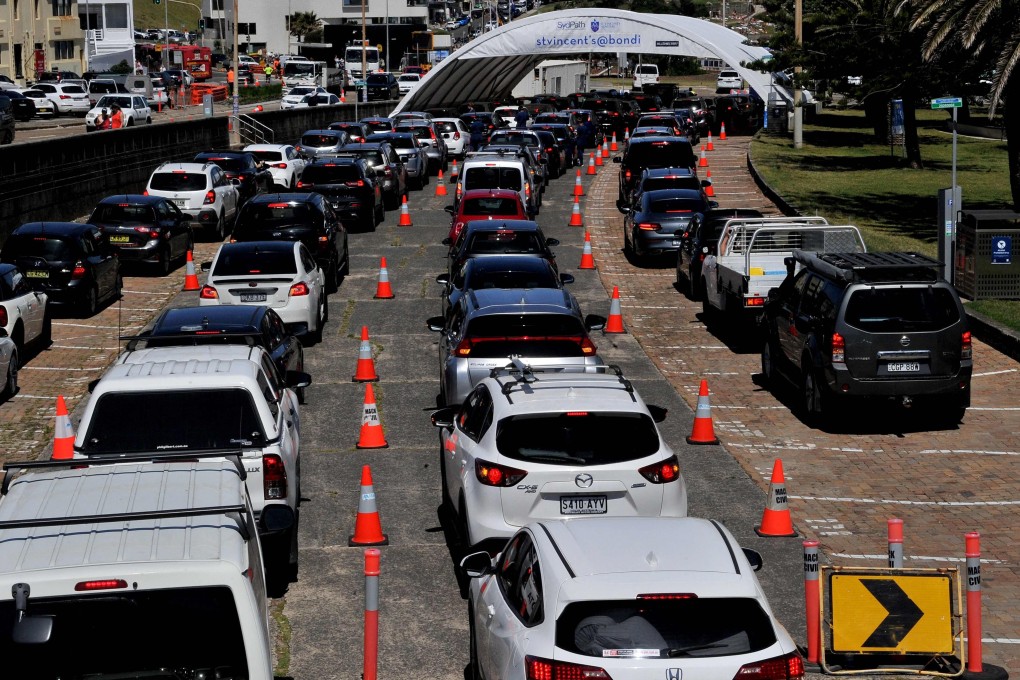 People queue in cars at Bondi Beach in Sydney to get tested for Covid-19. Photo: AFP
