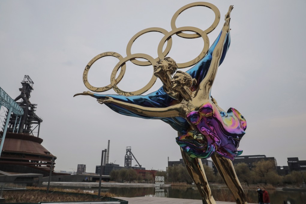 The Olympic rings rest on a statue of a figure skating couple near the headquarters of the 2022 Beijing Winter Olympics organising committee. Photo: EPA-EFE