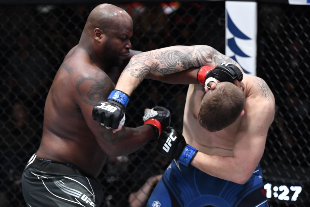 Derrick Lewis punches Chris Daukaus in their heavyweight fight during the UFC Vegas 45 event. Photo: Jeff Bottari/Zuffa LLC