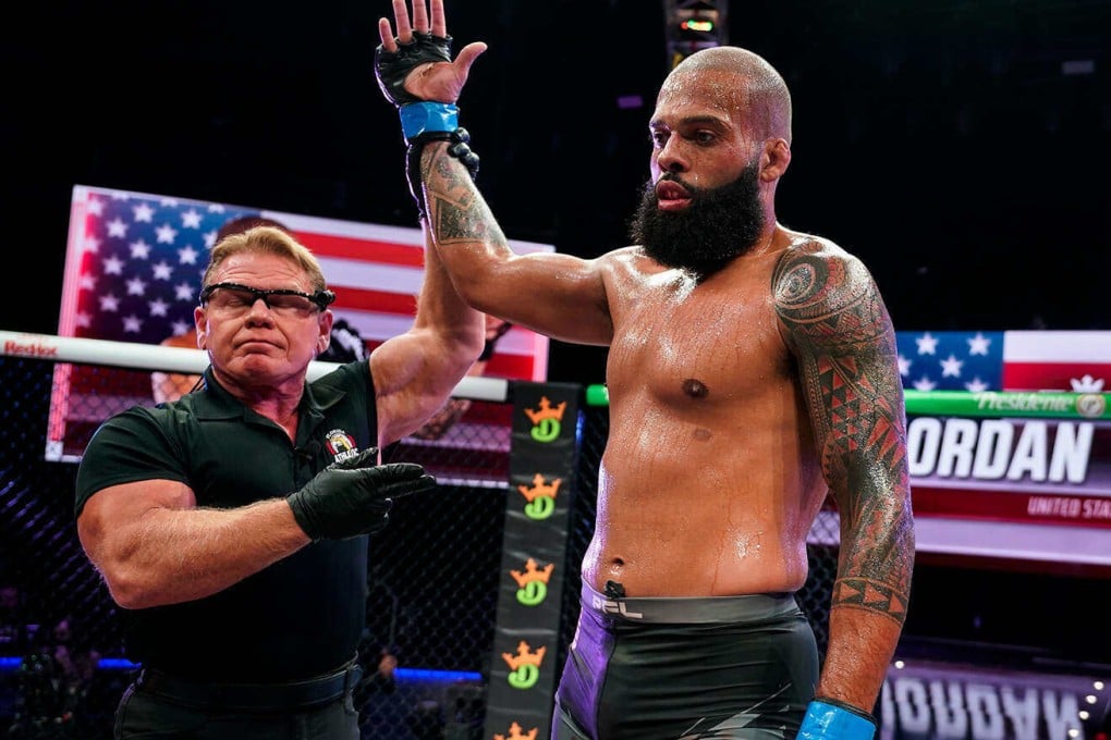 Jordan Young’s arm is raised in victory after beating Omari Akhmedov. Photo: PFL
